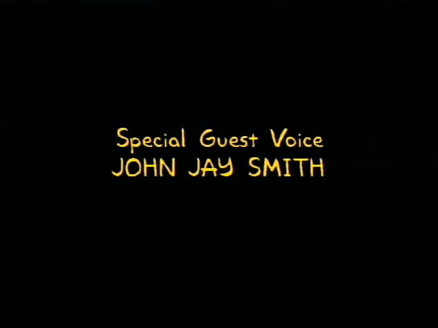 No animated characters appear; the moment is a plain black screen with centered yellow credit text that changes in turn
