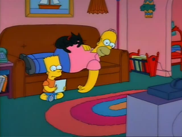 Bart sits cross-legged on the rug holding a sheet of paper while Homer sits on the brown couch beside him