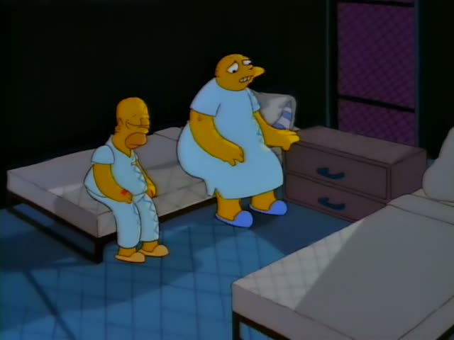 Homer sits hunched on the edge of a narrow bed while a heavy bald man in a light blue nightgown and blue slippers stands…