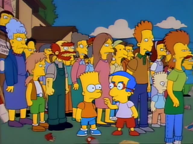 Bart stands in a crowd outside a storefront with Milhouse, who has blue hair and glasses, beside him, while Marge…