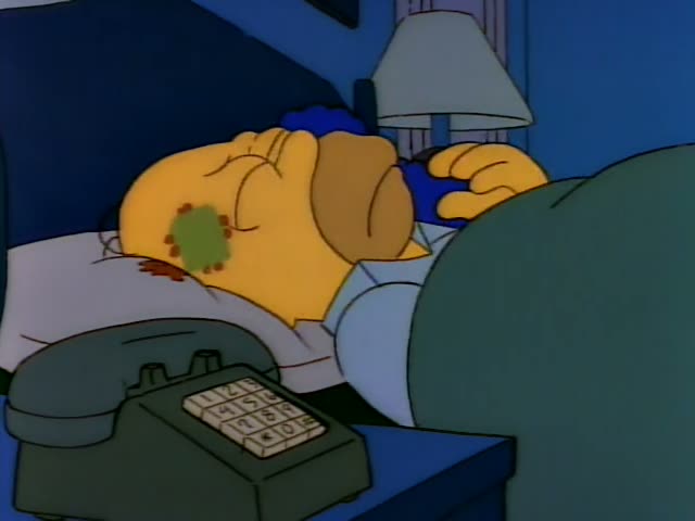 Homer lies in bed beside Marge, whose tall blue beehive rests on the pillow, with a grey-green telephone on the nightstand…