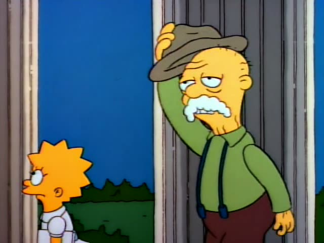 Lisa Simpson stands beside Grampa, a wrinkled bald old man with a white moustache in a green shirt and brown trousers…