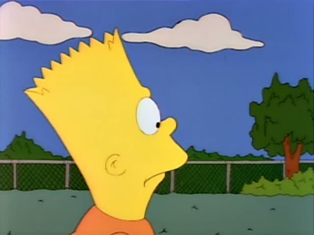 Bart Simpson stands on a grassy playground beside a chain-link fence while Lisa Simpson stands next to him