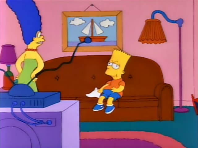 Marge stands by the TV stand in the living room while Bart sits on the brown couch in his orange shirt and blue shorts
