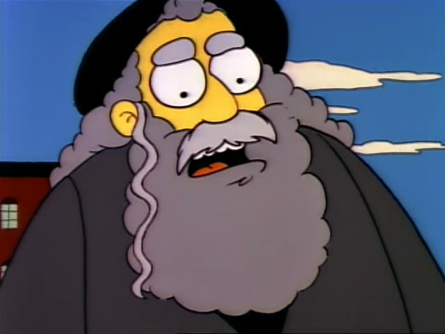 An elderly bearded man in a black hat and grey coat sits at an outdoor chess table with Lisa and Bart, in an orange shirt…