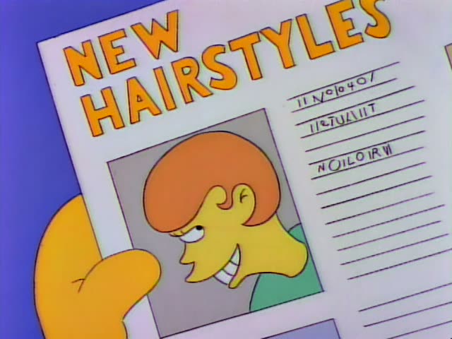 A grinning man with a bushy orange bowl-cut and a green shirt appears in a photo on a page headed "NEW HAIRSTYLES"…