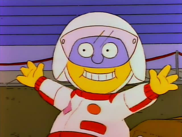 An astronaut-suited figure with a purple face and white helmet spreads its arms wide and grins beside a white car…
