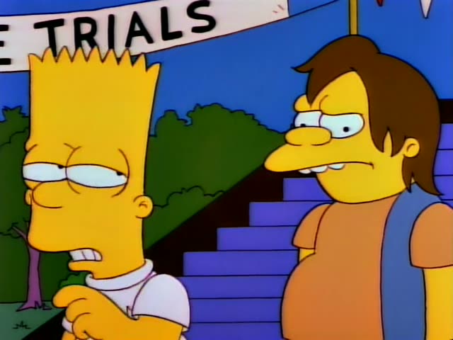 Bart stands with a finger raised beside Nelson, a bully in a blue vest over an orange shirt with brown hair, at a racing…