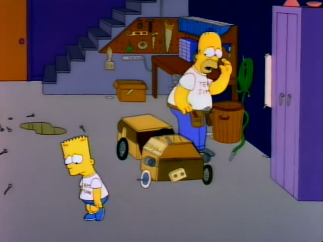 Homer Simpson sits in a cardboard go-kart in a garage while Bart stands beside the kart in the opening moment