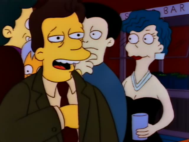 In a dim bar with a red sign reading BAR, a heavy man in a brown jacket and red tie stands beside a woman with a tall blue…