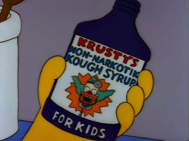 Homer Simpson stands at a counter in a purple-walled room and holds up a bottle of Krusty's Non-Narkotik Kough Syrup…