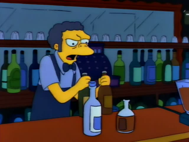 Moe stands behind the bar lifting bottles from and peering into an open cardboard box beside a cash register and shelves…