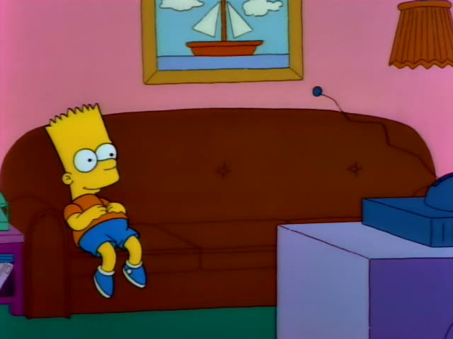 Bart sits on a brown couch with his arms folded, watching a TV under a sailboat painting and a lamp
