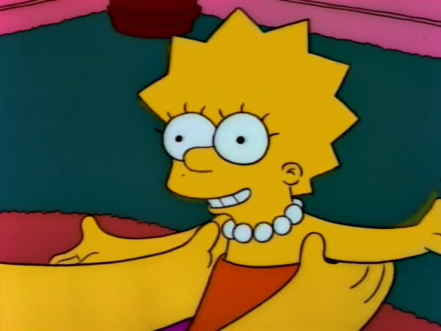 Lisa grins and gestures with outstretched arms in front of a large yellow arm, then looks startled with her mouth open…