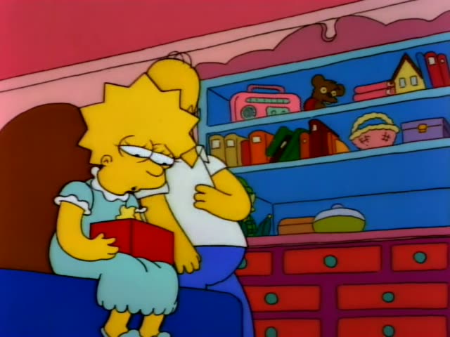 Lisa sits on a blue couch holding a red book while Homer stands beside her
