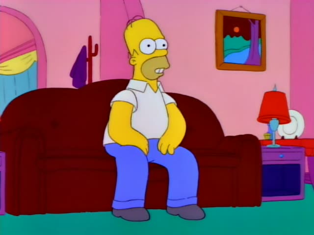 Homer Simpson sits on the dark red couch in the pink living room, with a red lamp and a framed painting on the wall…