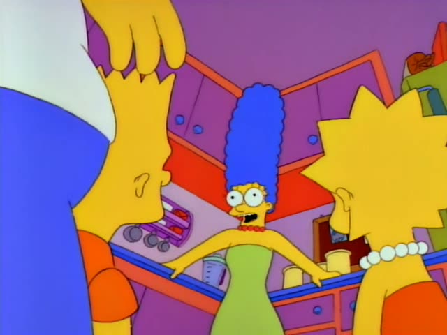 Marge Simpson stands at the kitchen counter making sandwiches while Homer looks on from behind