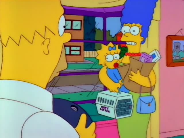 Homer stands in a doorway holding a black bowling ball, first facing Marge and Maggie and then grimacing down at the ball…