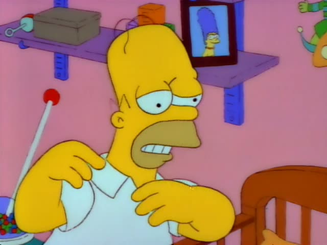 Homer Simpson stands beside a wooden crib in a pink nursery, rubbing his shoulder and then pressing both hands to his head…