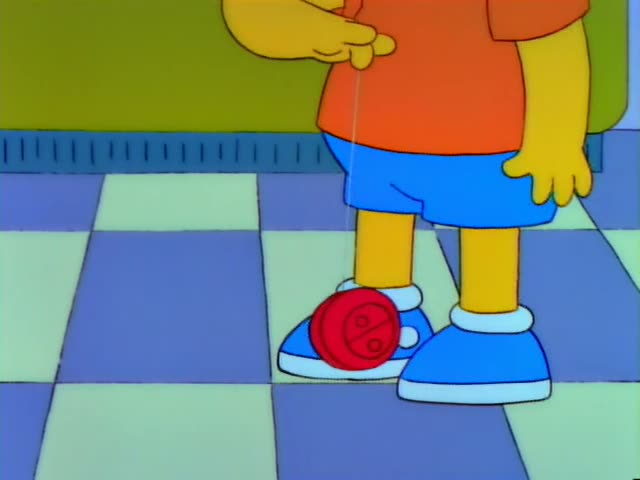 Bart Simpson stands on a checkered floor in front of a green wall and a red-and-blue painting of a house, holding a red…