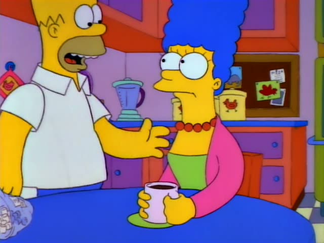 Homer and Marge stand at a blue kitchen table holding a coffee cup