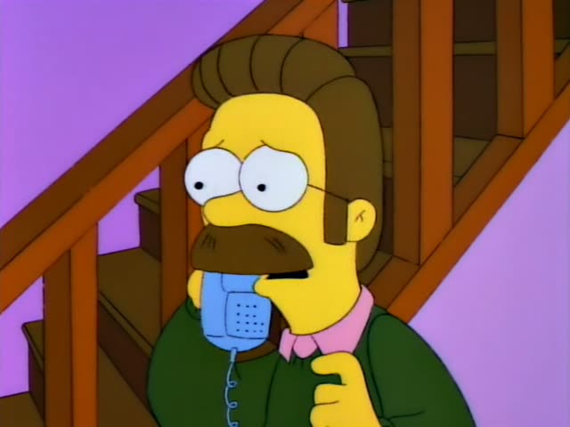 Ned Flanders stands by a wooden staircase holding a blue telephone to his ear with a wide-eyed, worried expression