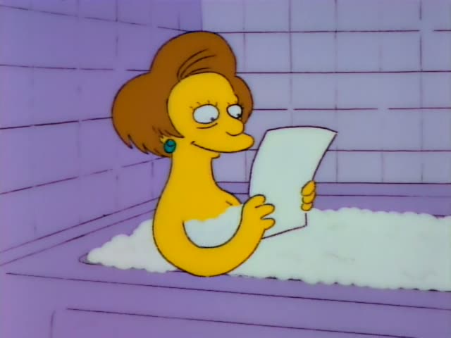 Mrs. Krabappel sits in a bubble-filled purple bathtub reading a sheet of paper