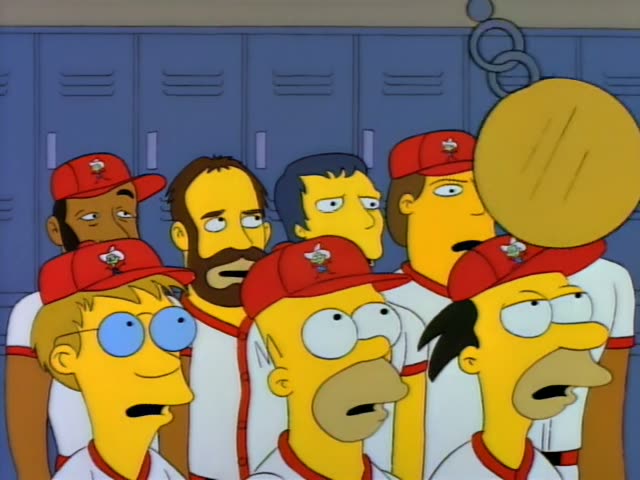 Homer stands in front of blue lockers with Lenny and Carl, the Black man in the back right, along with several other players…