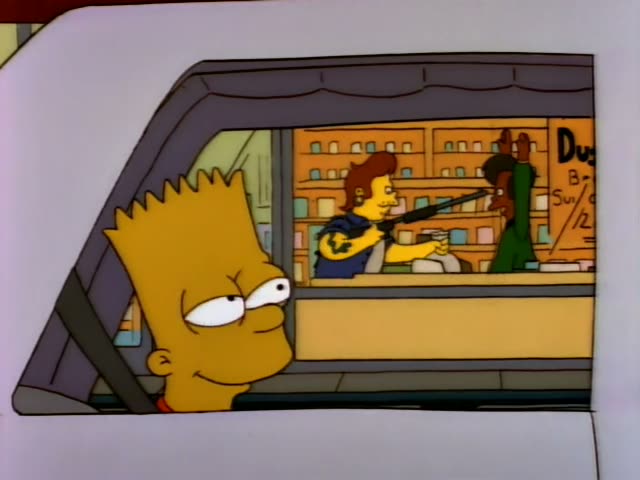 Bart Simpson sits in the back of a police car while Chief Wiggum and a Black officer in a cap sit in front, the officer…