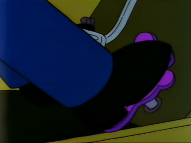Apu sits bound with white rope wrapped around his torso and a wooden chair inside the store, which has a counter, stacked…