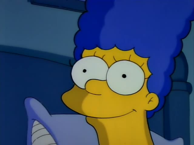 Marge Simpson appears in close-up in the first four frames, smiling with wide eyes and then looking worried and wide-eyed…