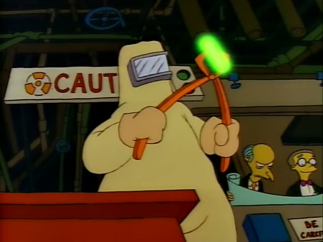 Homer grips an orange tool with a glowing green rod beside a CAUTION sign while Mr. Burns and Smithers watch…