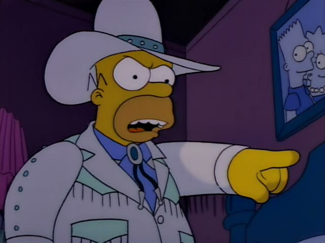 Homer stands angrily pointing at a framed picture of two children on a purple wall
