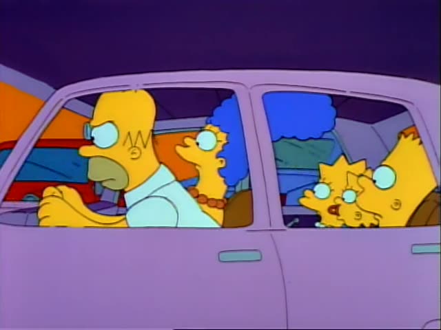 Homer, Marge, Bart and Lisa sit in a lilac family car, with Homer driving and Marge beside him, as they approach…