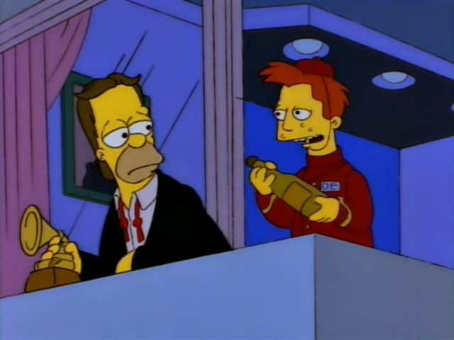 Herb stands at a balcony rail holding a gold award statuette while a red-haired attendant in a red uniform with a name tag…
