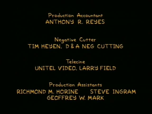 A black closing credits sequence with gold text on a dark background