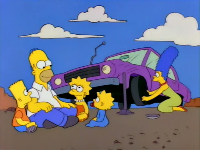 Homer, Marge, Bart, Lisa and Maggie are gathered in a dusty desert setting beside a purple car raised on a jack, with Marge…