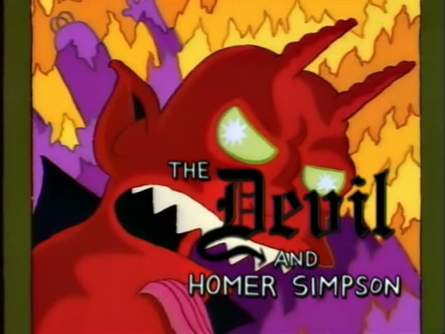 Homer Simpson sits in a plush theater audience holding a program beside a woman with a red updo in a green gown and a man…