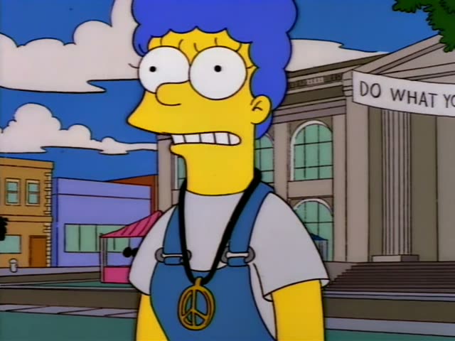 Marge stands outside in front of a columned building, first alone and then joined by Ned Flanders in his green sweater…