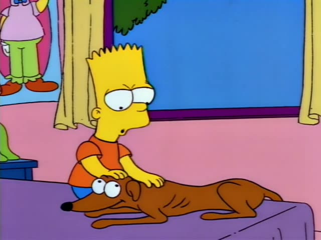 Bart sits on a purple table in a pink room, petting Santa's Little Helper, the family's brown greyhound, who lies stretched…
