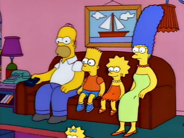 Homer, Bart, Lisa and Marge sit side by side on the brown couch in the pink living room, with Maggie's small figure visible…