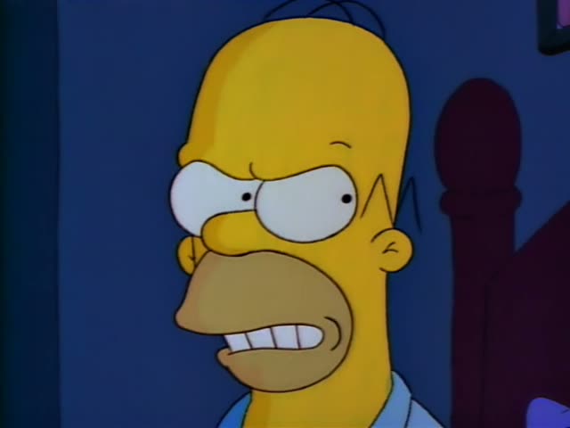 Homer, Marge, Bart and Lisa are in the Simpsons' living room, with Marge seated on the green couch and Bart and Lisa…