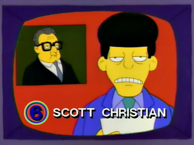 A one-off TV newscaster with a black pompadour, blue jacket and green tie, labeled SCOTT CHRISTIAN by a caption, reads…