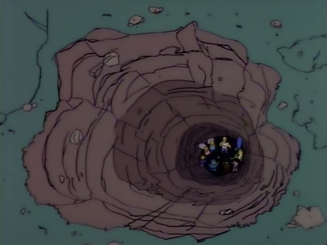 A group of small figures, including Marge with her tall blue beehive, sits at the bottom of a deep round pit in pinkish…