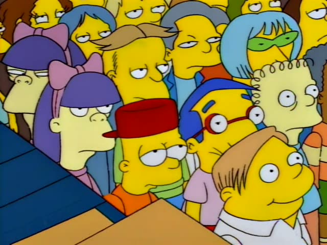 Bart in an orange shirt and red cap and Milhouse with blue hair and glasses are among a crowd of children in a wood-floored…