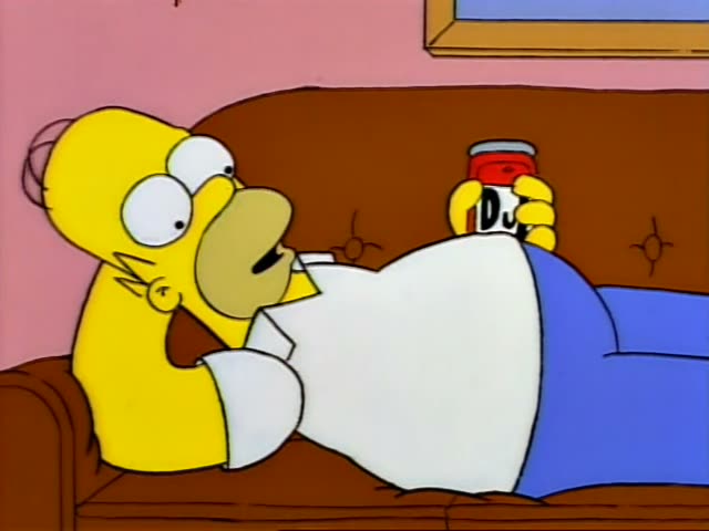 Homer Simpson and Bart Simpson are in the living room, with Homer sprawled on the brown couch at first and then sitting…