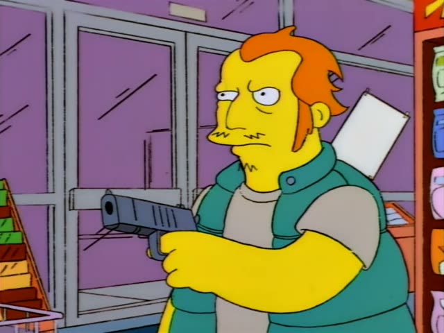 A stocky man with swept-back orange hair, a moustache, and a green vest over a grey shirt aims a handgun in the Kwik-E-Mart…