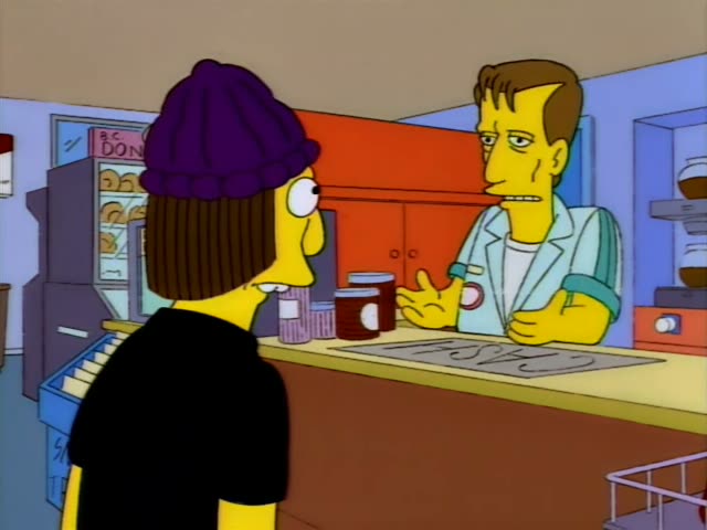 A young customer in a purple knit beanie and black shirt, seen from behind, stands at the counter of a convenience store…