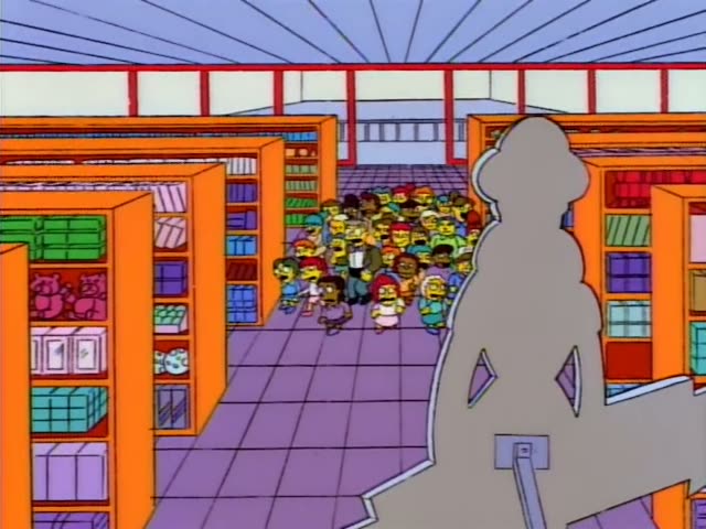 A large, excited crowd of kids and grown-ups pushes down a purple-floored toy store aisle, with a tall blue beehive hairdo…