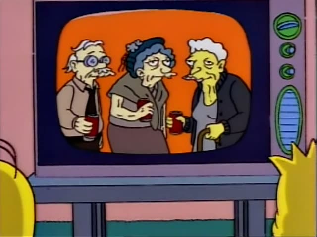 On a TV screen, three elderly figures stand together against an orange backdrop: a bespectacled old man in a tan sweater…